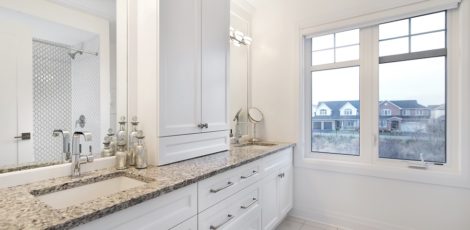 Spacious 5-piece main bathroom with an oversized window and extra storage space.