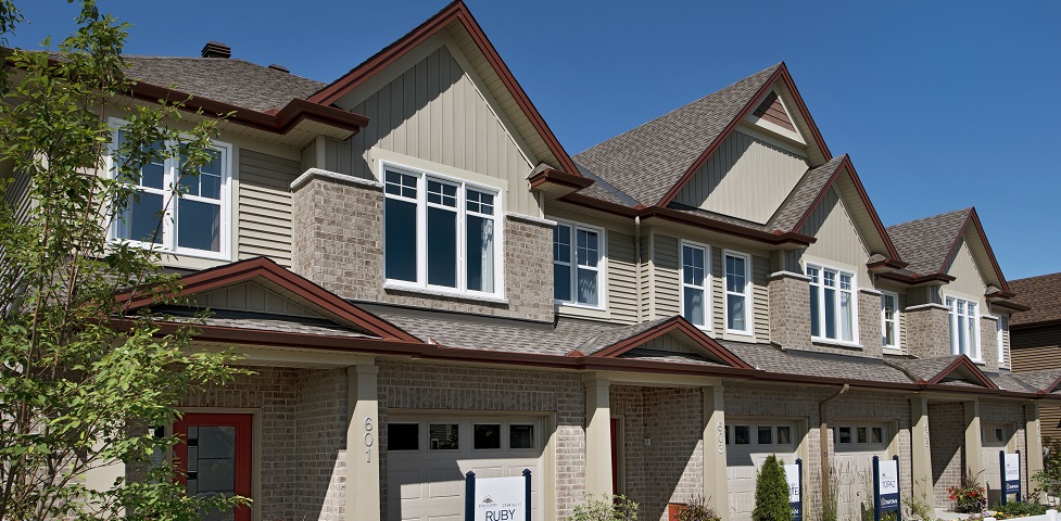 Exterior view of a block of 2-storey model townhomes.