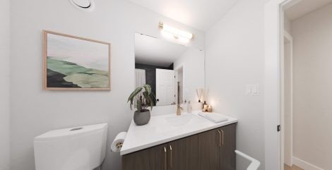 Basement bathroom with white counter, one sink and shower.