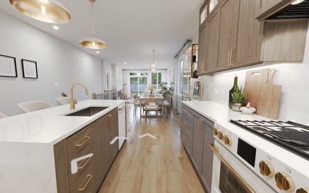 Kitchen with island, cabinets to the ceiling and a walk-in pantry.