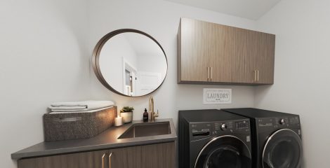 Laundry Room with sink, counter, mirror, upper cabinets & appliances.