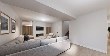Basement Rec Room with fireplace and large sectional sofa.